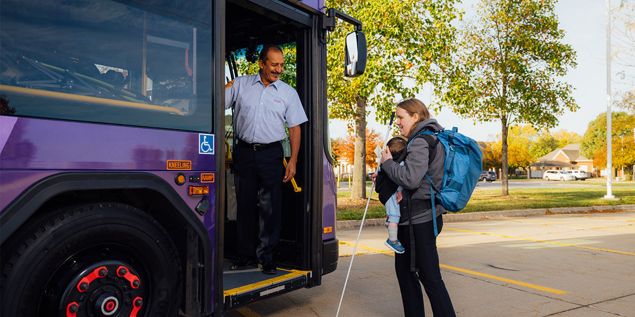 Bua driver greeting blind woman with her baby.